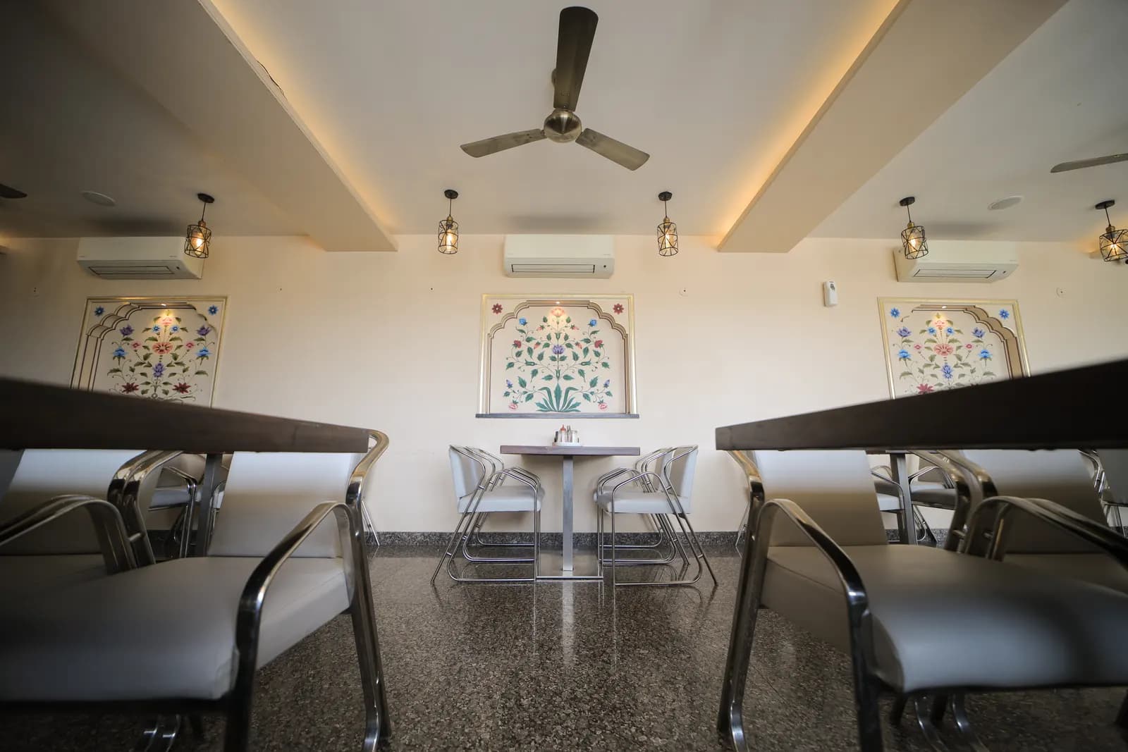 Cheelgadi restaurant dining hall with Rajasthani murals in Jaipur